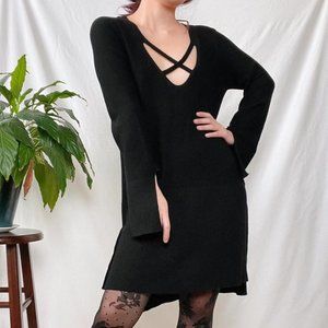 Free People strappy knit tunic with high slits on the sides and at the sleeves.